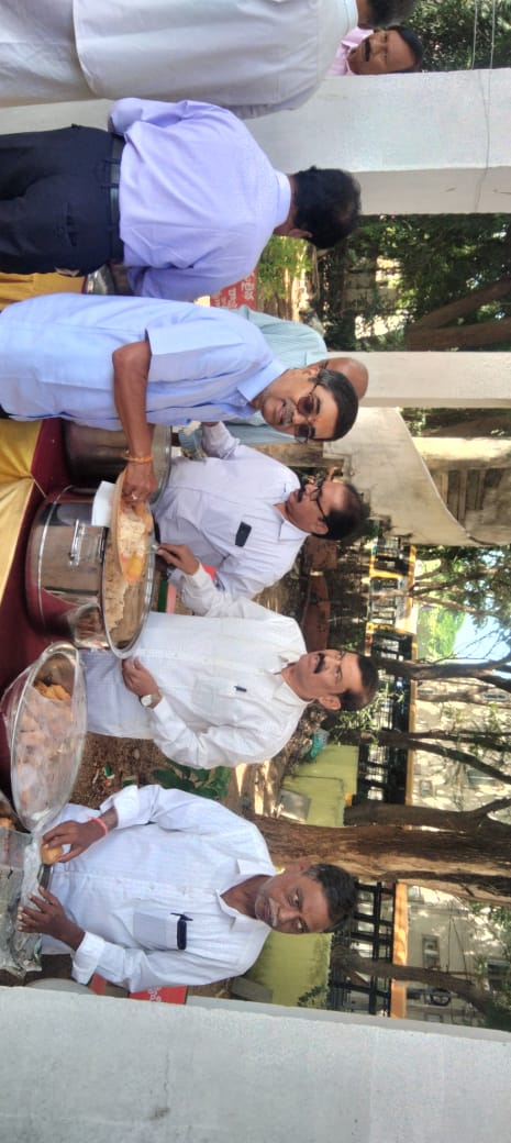 The men team serving food in Karteeka Vana Bhojanaalu.jpg